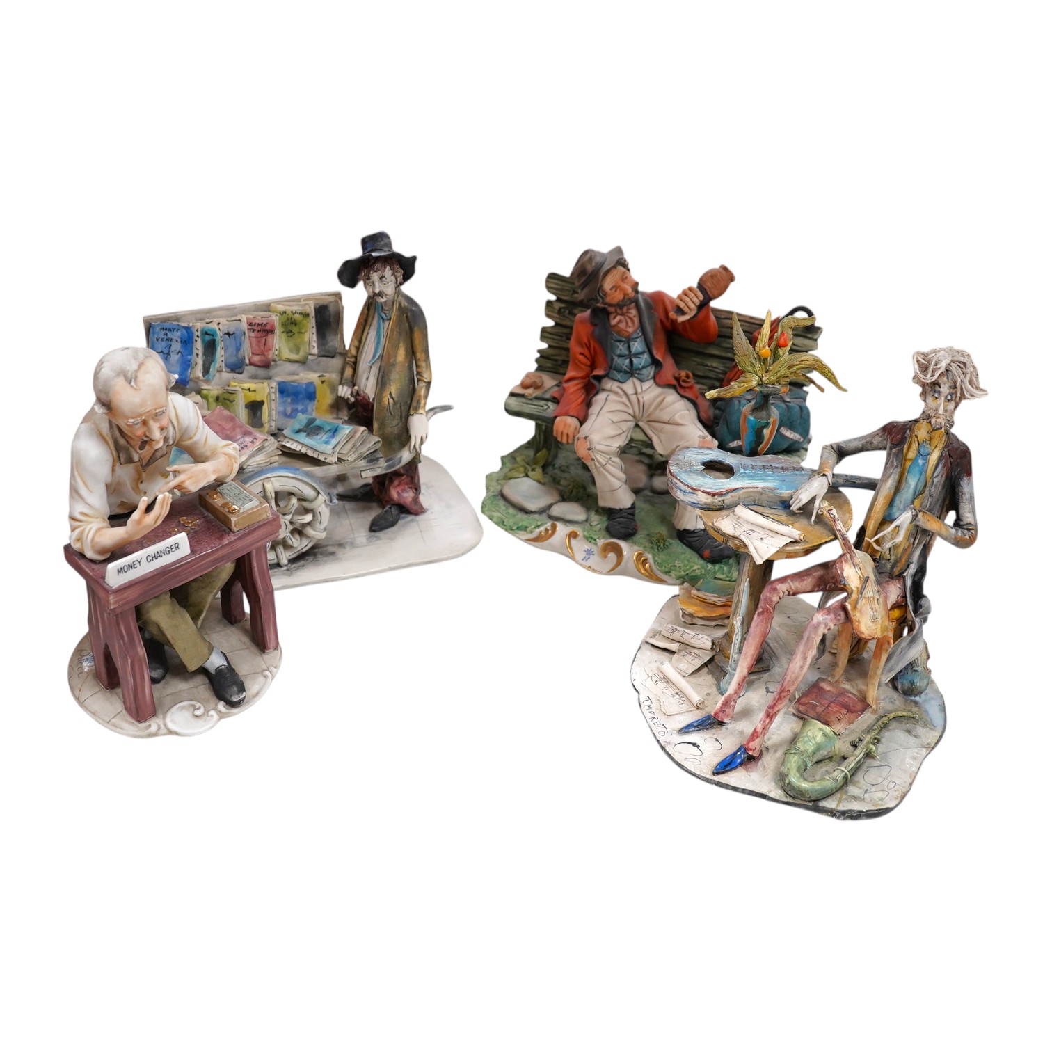 Four Italian ceramic figures to include Capodimonte money changer, 20cm. Condition - poor to fair